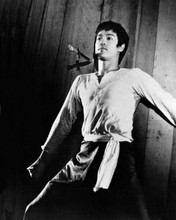 Bruce Lee dodges knives thrown at him 1972 Fists of Fury 8x10 inch photo