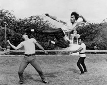 Bruce Lee leaps in the air with kung fu kick Fists of Fury 8x10 inch photo