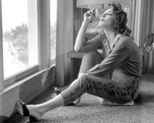 Allison Hayes sits on floor smoking cigarette 8x10 inch photo