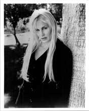 Daryl Hannah in black jacket poses by tree 8x10 inch photo