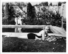 Carole Lombard sunbathing on grass by pool 8x10 inch photo