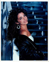Gloria Estefan smiling pose leather jacket pulled from shoulder 8x10 inch photo