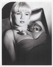 Traci Lords sitting in chair in low cut dress 8x10 inch photo 1990's era