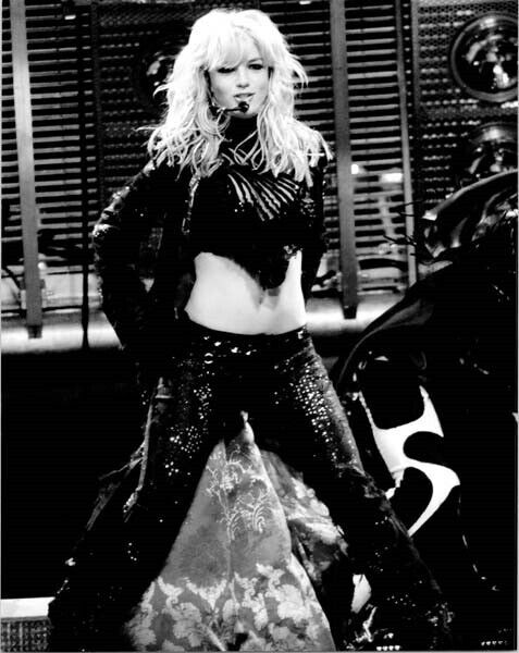 Britney Spears in two piece black outfit performs on stage 8x10