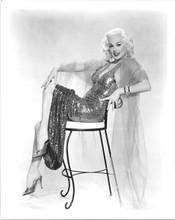 Mamie Van Doren wearing sequined dress sat on chair 8x10 inch photo