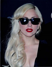 Lady Gaga in low cut black dress & shades poses for cameras 8x10 press photo