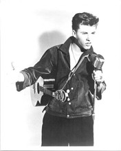 Rick Nelson with his guitar holding microphone 8x10 inch photo