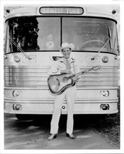 Ernest Tubb poses with his guitar in front of his tour bus vintage 8x10 photo