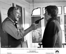 The Shootist 1976 original 8x10 photo John Wayne points gun at Rick Lenz