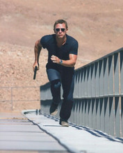 Daniel Craig as Bond running across bridge 2006 Casino Royale 8x10 inch photo
