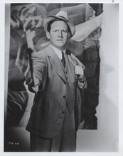 Spencer Tracy in suit and hat holding paint brush 8x10 inch photo