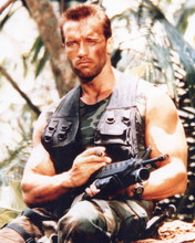 Arnold Schwarzenegger sits with cigar & AR-15 gun Dutch from Predator 8x10 photo