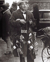 Peter Sellers plays ukulele in coat with flags 1973 The Optimists 8x10 photo