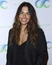 Sarah Shahi in black jacket smiles for press on red carpet 8x10 inch photo