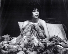 Jane Fonda sits up in bed holding fur rug 1972 Steelyard Blues 8x10 inch photo