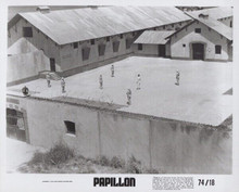 Papillon 1974 original 8x10 photo Steve McQueen stands in prison yard