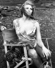 Raquel Welch in cave girl outfit sits on set One Million Years BC 8x10 photo