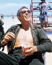 James Coburn relaxes on set 1967 In Like Flint bare chested on beach 8x10 photo