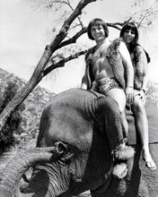Sonny and Cher sit atop an elephant 1967 movie Good Times 8x10 inch photo