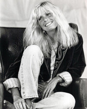 Kim Carnes 1980's pose smiling seated in chair 8x10 inch photo