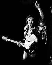 Jimi Hendrix gets into the mood on stage holding guitar 8x10 inch real photo