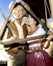 The High Chaparral Leif Erickson & Linda Cristal pose by ranch bell 8x10 photo