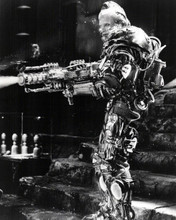 Arnold Schwarzenegger blasts away as Mr Freeze in Batman & Robin 8x10 inch photo