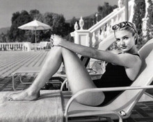Cameron Diaz in black swimsuit sitting on chair by pool 8x10 inch photo