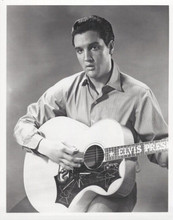 Elvis Presley strums in monogrammed guitar vintage 8x10 inch photo