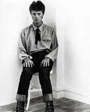 David Bowie seated wearing western style boots and clothing 1970's 8x10 photo