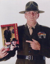 R. Lee Ermey holds up Full Metal Jacket action figure vintage 8x10