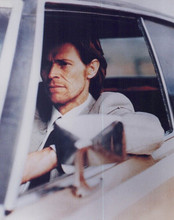 Willem Dafoe sits at wheel of car 8x10 inch photo