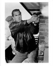 Steven Seagal 8x10 photo in action wearing leather jacket pointing gun