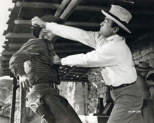The Big Country Gregory Peck takes a swing at Chuck Connors 8x10 inch photo