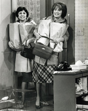 Laverne and Shirley smile holding groceries in apartment 8x10 inch photo