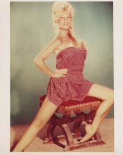 Brigitte Bardot vintage 8x10 inch photo early pose on red stool in short dress
