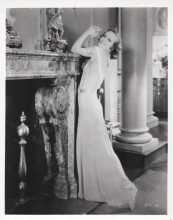 Joan Crawford vintage 8x10 inch photo posing next to fireplace