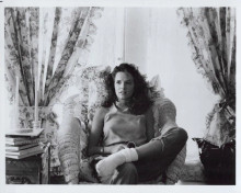 Lea Thompson 1980's era original 8x10 inch photo seated in chair