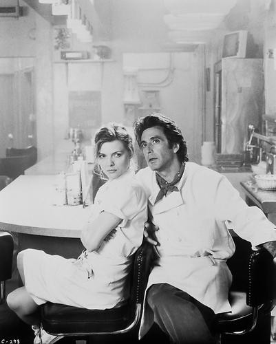 This is an image of 17028 Al Pacino & Michelle Pfeiffer Photograph & Poster
