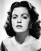 This is an image of Photograph & Poster of Faith Domergue 100879