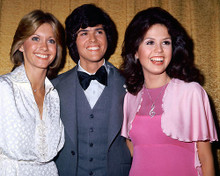 This is an image of 265628 Olivia Newton-John, Marie & Donny Osmond Photograph & Poster