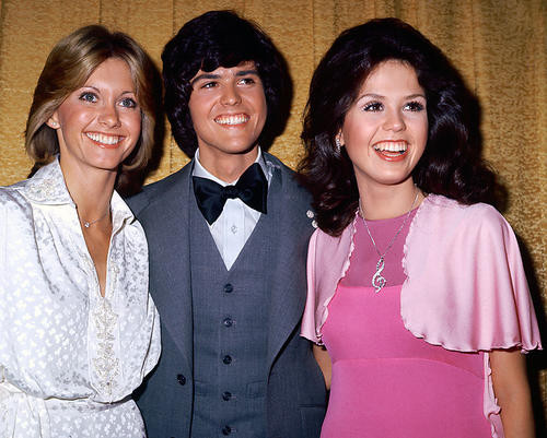 This is an image of 265628 Olivia Newton-John, Marie & Donny Osmond Photograph & Poster
