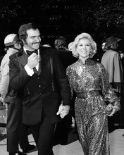 This is an image of 198365 Burt Reynolds and Dinah Shore Photograph & Poster