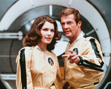 This is an image of 252064 Roger Moore & Lois Chiles Photograph & Poster