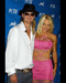 This is an image of 250066 Pamela Anderson and Kid Rock Photograph & Poster
