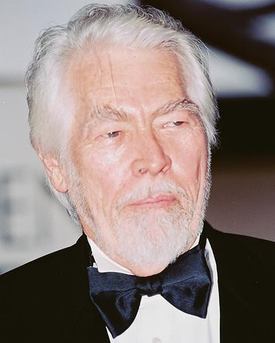 This is an image of 237501 James Coburn Photograph & Poster