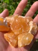 Orange calcite rough pieces (1447940996)