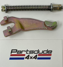 Transfer case mounted parking brake lever kit with rod and spring