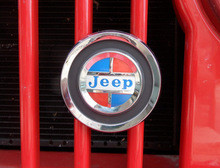 Grill emblem,  Reproduction grill emblem. Found on AMC era jeeps. Metal casting, chrome plated, raised letters, polished, painted to original colors.  Comes complete with mounting brac...
