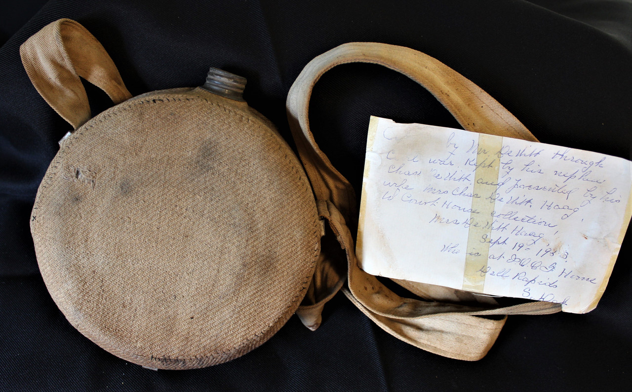 Complete canteen with Civil War soldier identification Yankee Rebel